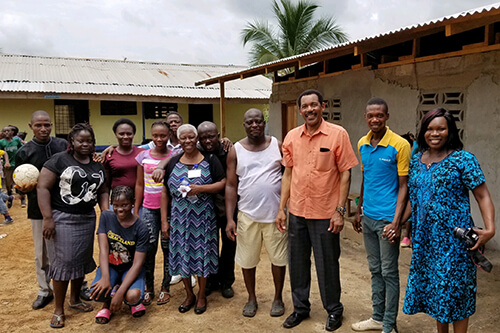 Quencina Gardner with a group of people in Liberia