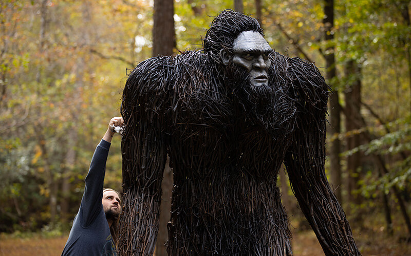 Jesse Duke puts the finishing touches on his sculpture