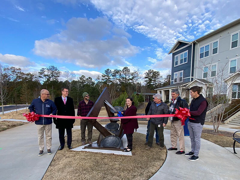 UWG and Newnan community members at sculpture ribboncutting