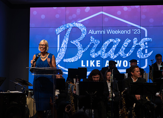 UWG's Vice President for University Advancement Dr. Meredith Brunen addresses a crowd onstage 