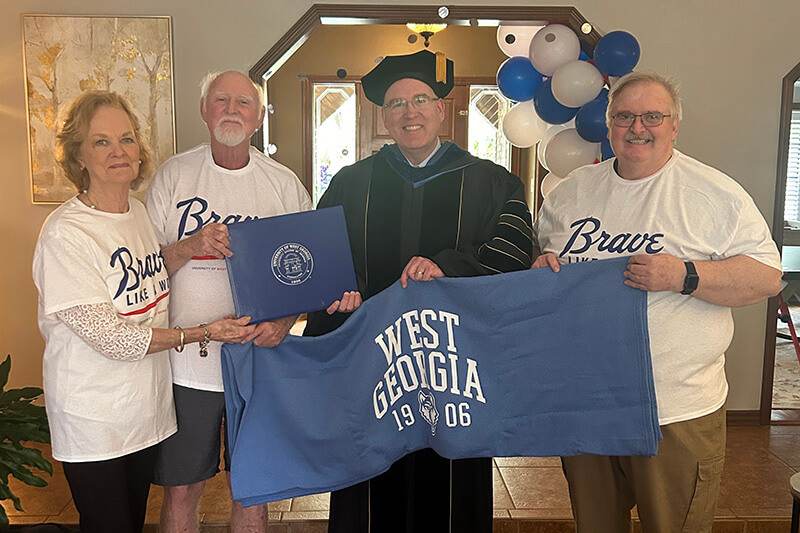 L to R: Mary Ann Hamil Barnes ’68; Mack Barnes; Dr. Jon Preston, UWG provost and senior vice president; Mark Camp