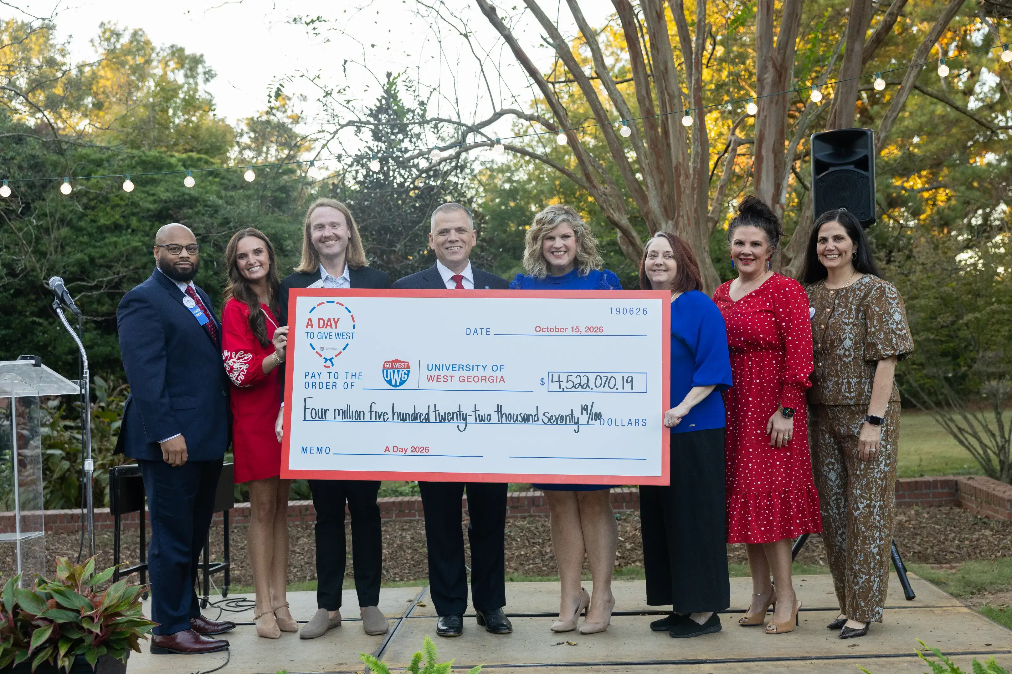 UWG administration, staff and friends hold a giant check