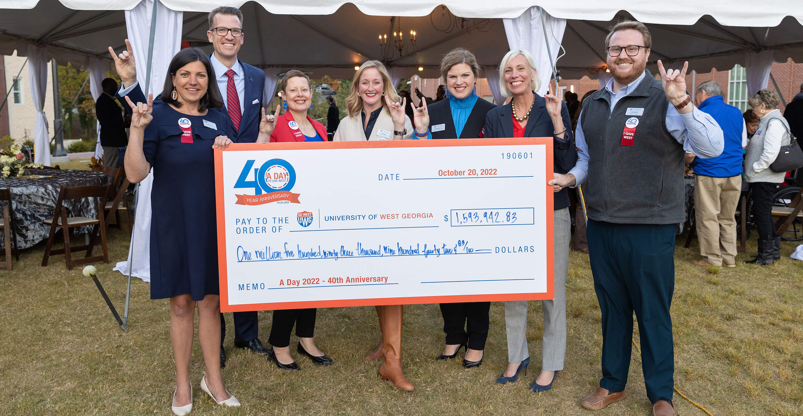 UWG friends and family hold a giant check