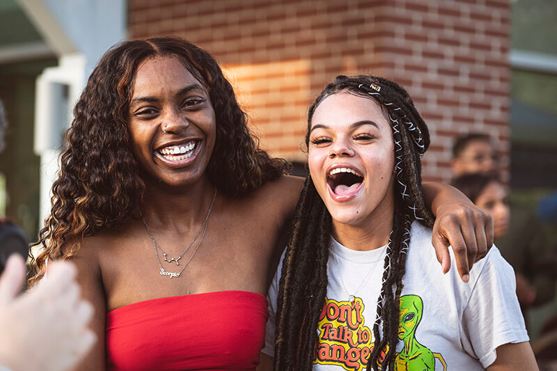 Two laughing UWG students