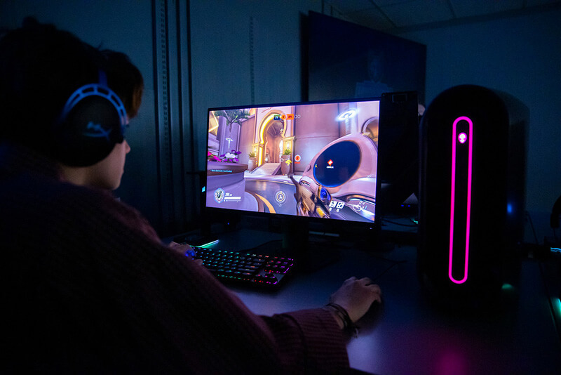 young student playing a computer game