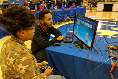 A UWG student chooses her character during a video game competition