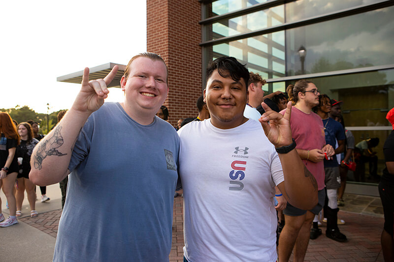 Two students outside on campus at UWG