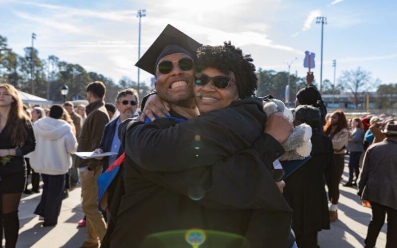 Graduates embracing outside UWG's Fall Commencement