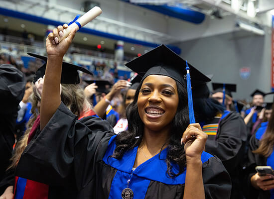 UWG graduate celebrating at commencement