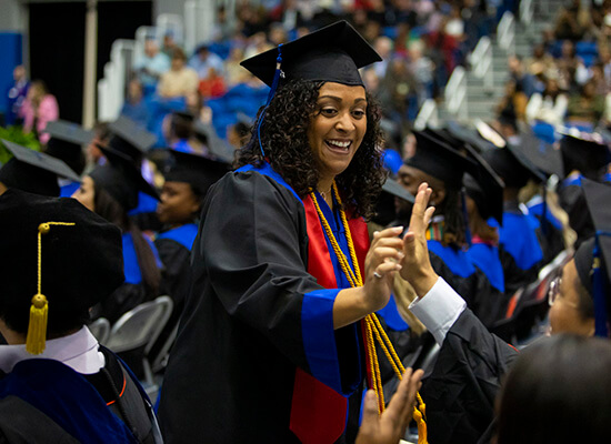 Ericka Moore celebrating at commencement