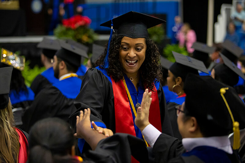 Erica Moore celebrating at commencement