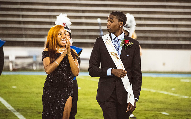 Members of the Homecoming court on the football field