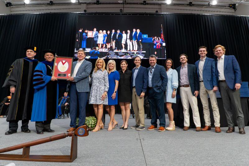 Members of the Stone family accept the inaugural President's Medallion