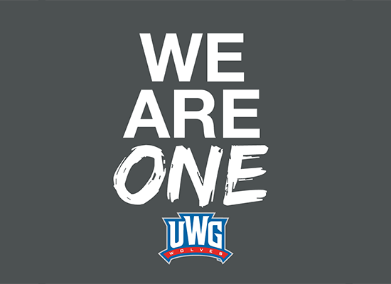 Graphic with white letters on gray background that reads "We Are One" with the UWG Wolves logo underneath