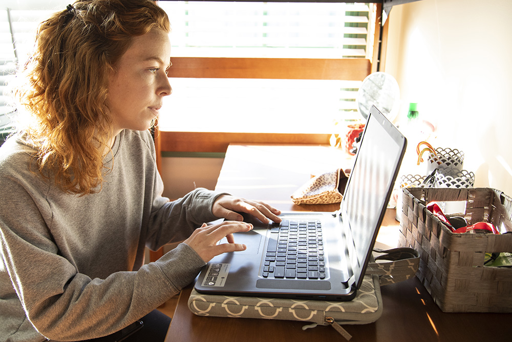 Student working on a laptop