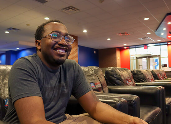 Smiling student playing Esports