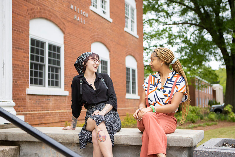 Two UWG students chatting outside on campus
