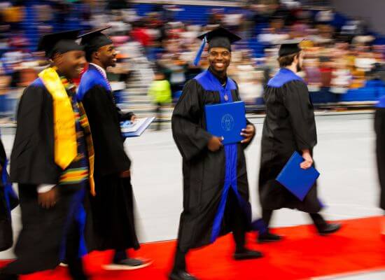 Smiling graduate at UWG Commencement
