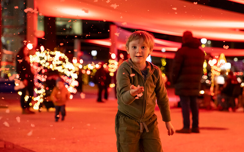 A child playing outside in the snow