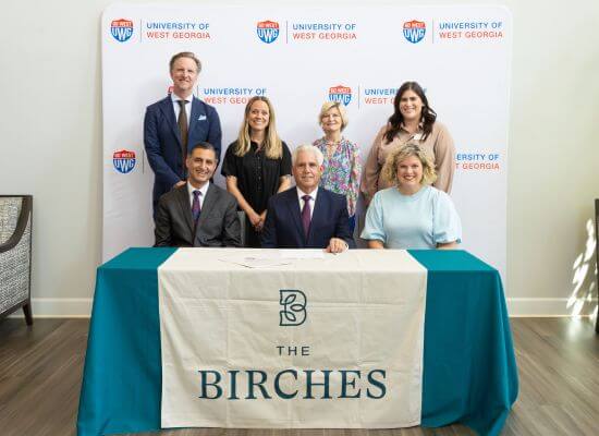 The signing of the partnership between The Birches on Maple and the University of West Georgia.