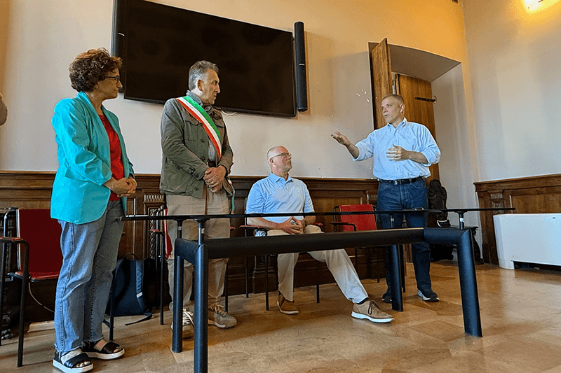 Dr. Michael Johnson, UWG president, speaks with Italian officials