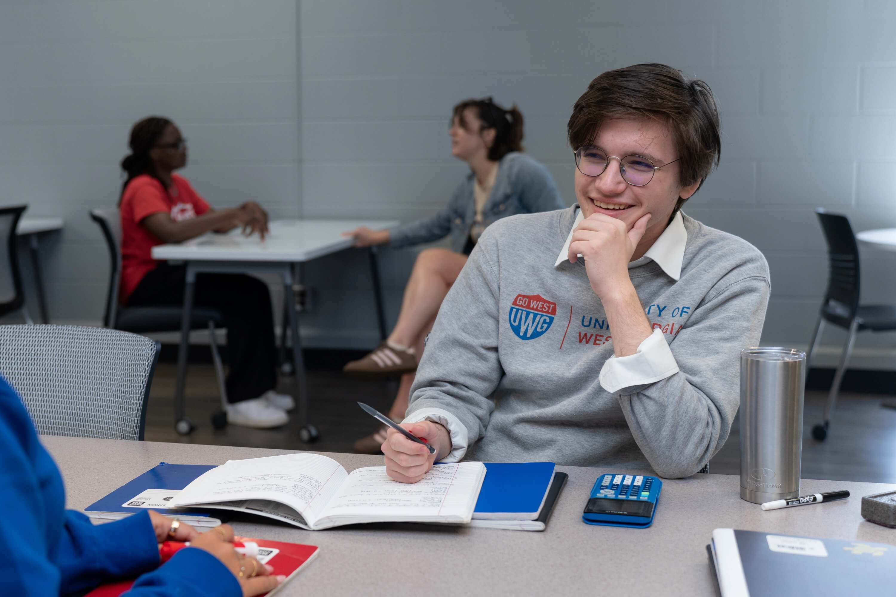 A UWG student laughing in class 