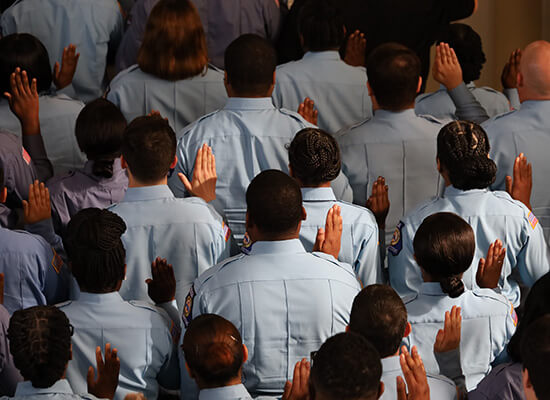 Officers raising their hands