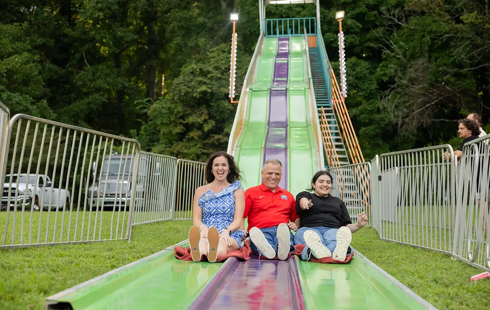 Dr. Michael and Beth Johnson sliding at Welcome Back Blast
