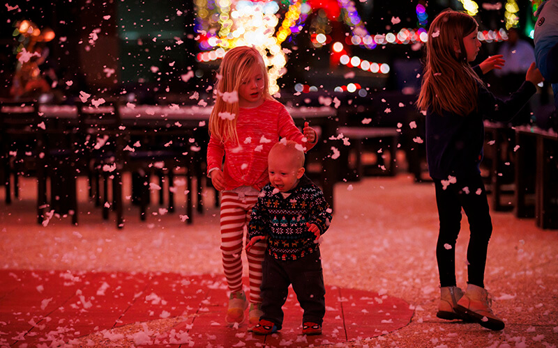 Kids playing in the "snow" at UWG's Winter West