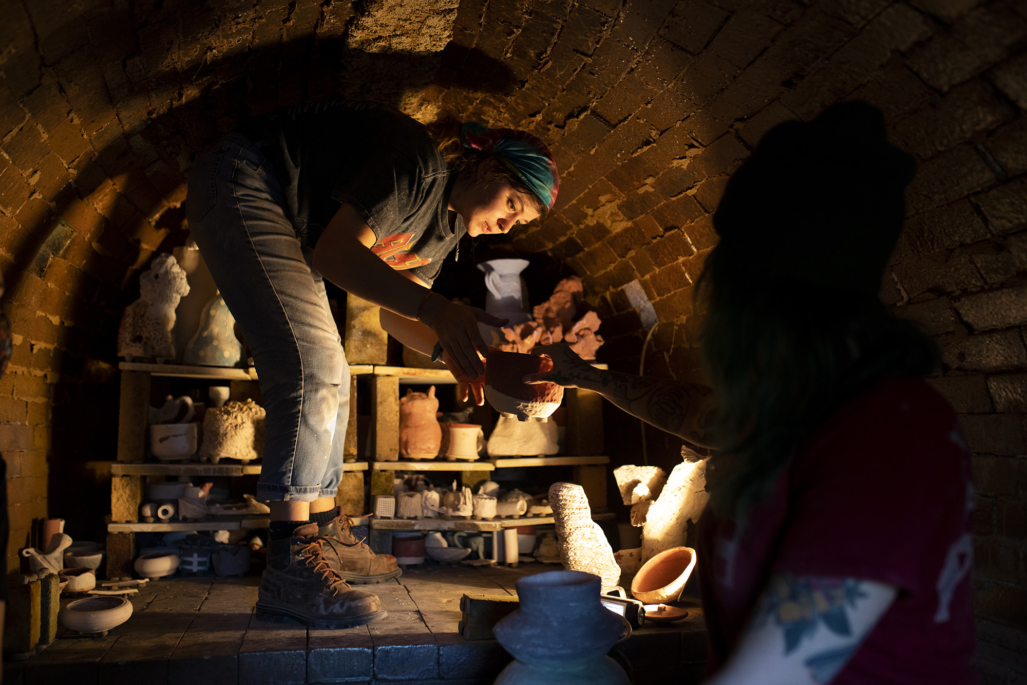 Students inside the anagama kiln