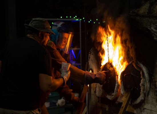 UWG art student fires an anagama kiln