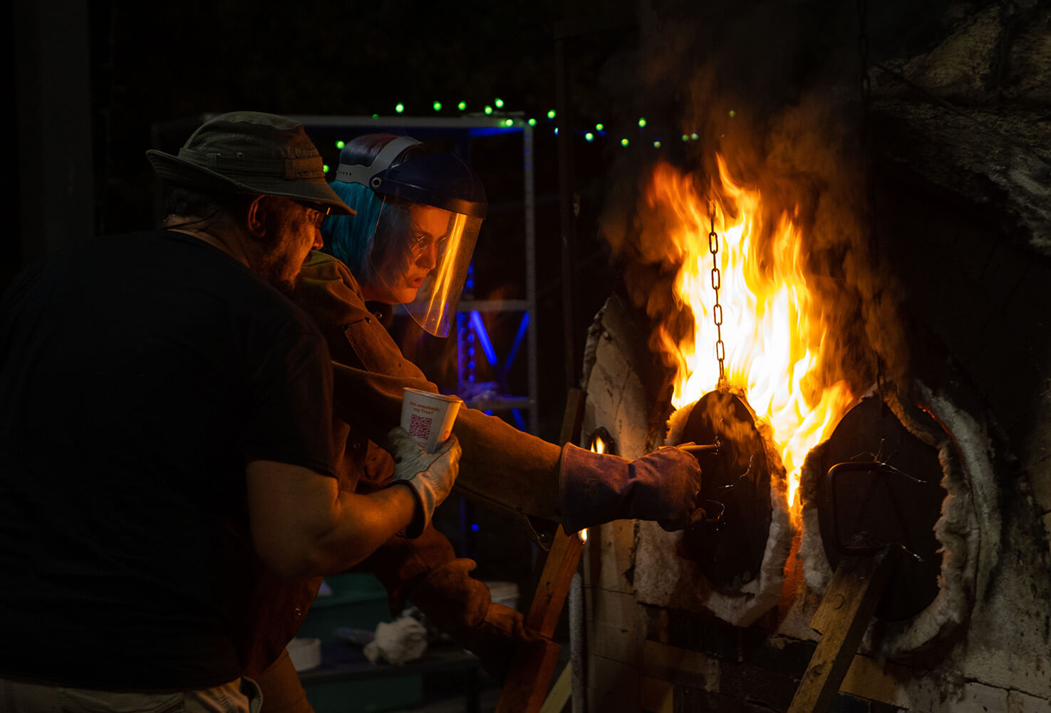 UWG art faculty and students work at the anagama kiln on campus