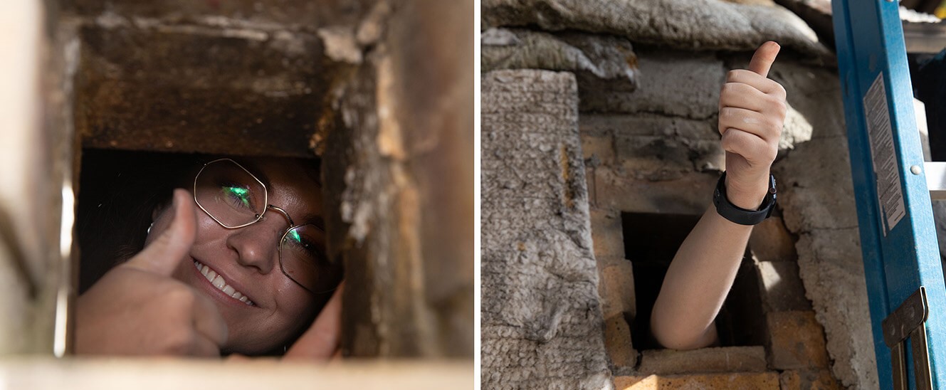Student demonstrates a vent window in the anagama kiln. Once fired, flames can escape and be viewed from a safe distance.