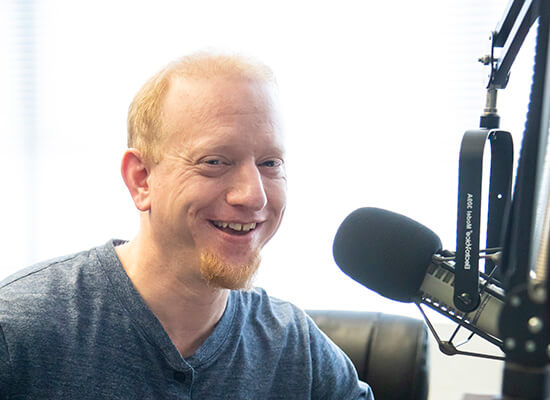 Dr. Nick Sterling at a microphone