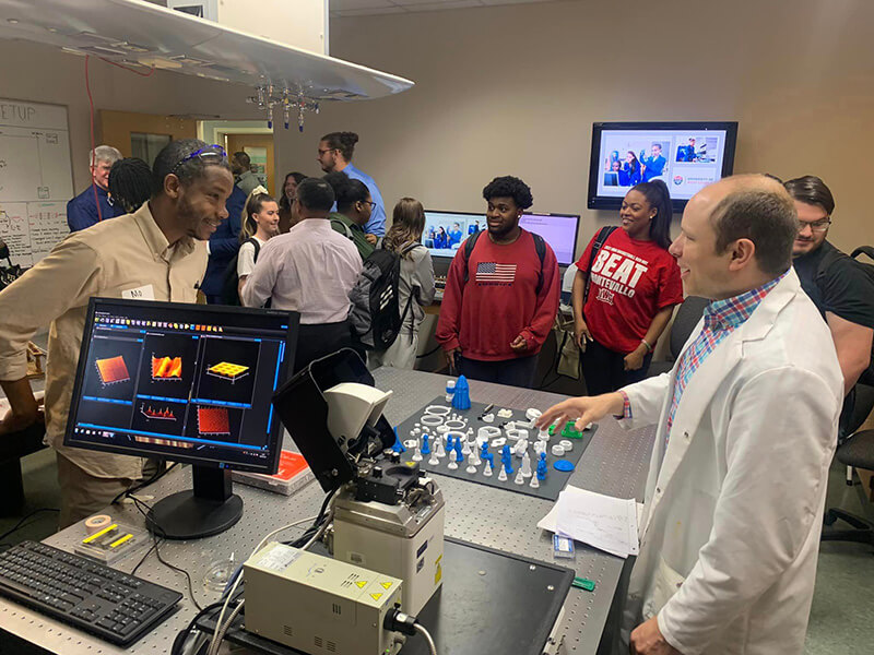 University of West Georgia Associate Professor of Chemistry Dr. Martin McPhail speaks to students at the Materials Science Lab open house.