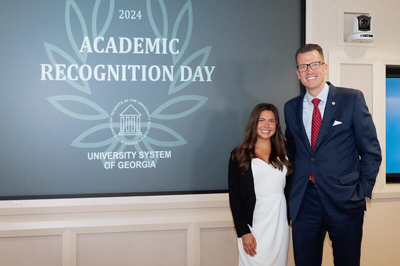 Malia Pope with Dr. Brendan Kelly, UWG president