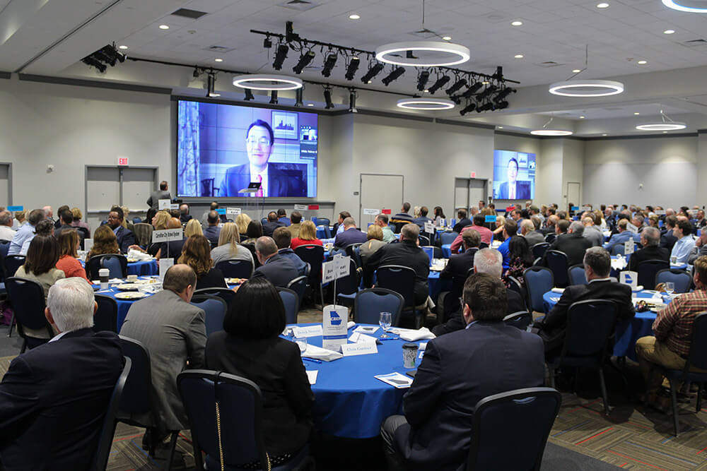 People sitting at tables at UWG's 25th annual Economic Forecast Breakfast