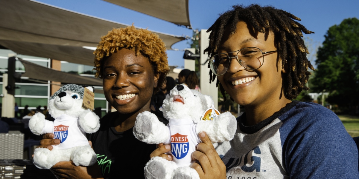 UWG students with Wolfie stuffed animals. 