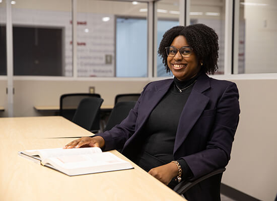 UWG Richards College of Business student sitting at a table in a classroom