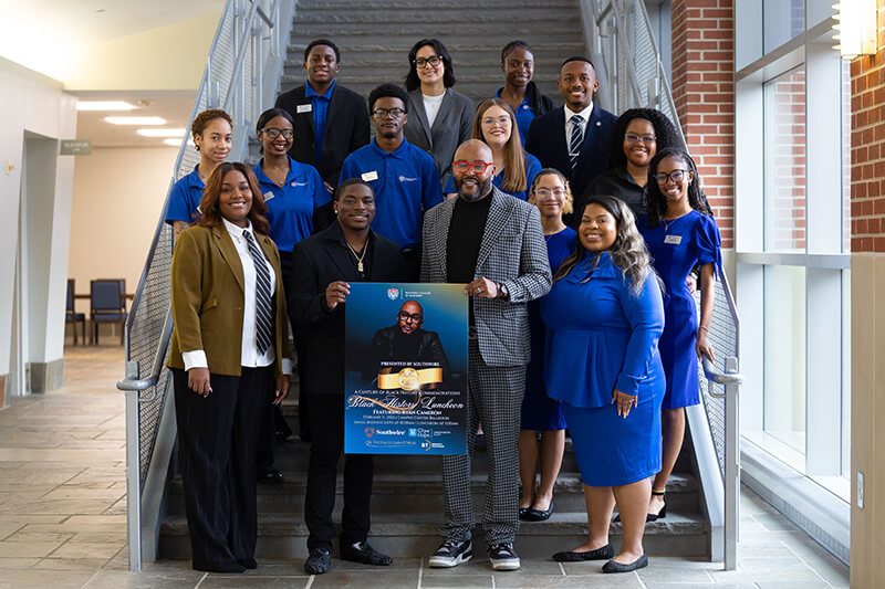 UWG students with Ryan Cameron celebrate the annual Black History in Business Luncheon