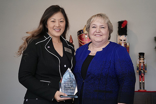 Kim Holder, left, with Dr. Faye McIntyre, dean of the Richards College of Business