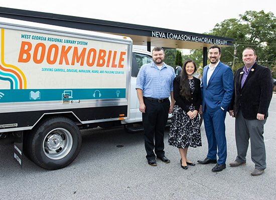 L to R: Duane Theobald, UWG Center for Economic Education and Financial Literacy program manager; Kim Holder, UWG Center for Economic Education and Financial Literacy director; Stephen Houser, WGRLS director; and Justin Nobles, WGRLS head of patron experience. Photo by Steven Broome.