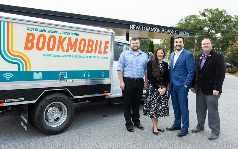 L to R: Duane Theobald, UWG Center for Economic Education and Financial Literacy program manager; Kim Holder, UWG Center for Economic Education and Financial Literacy director; Stephen Houser, WGRLS director; and Justin Nobles, WGRLS head of patron experience. Photo by Steven Broome.