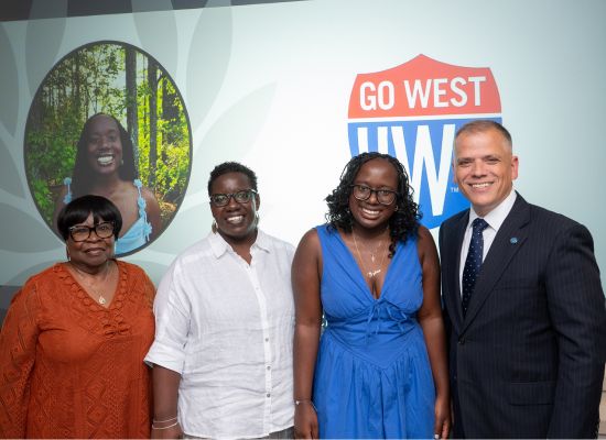 Madison Brooks, second from right, was joined by family members and Dr. Michael Johnson, UWG president, on Academic Recognition Day.