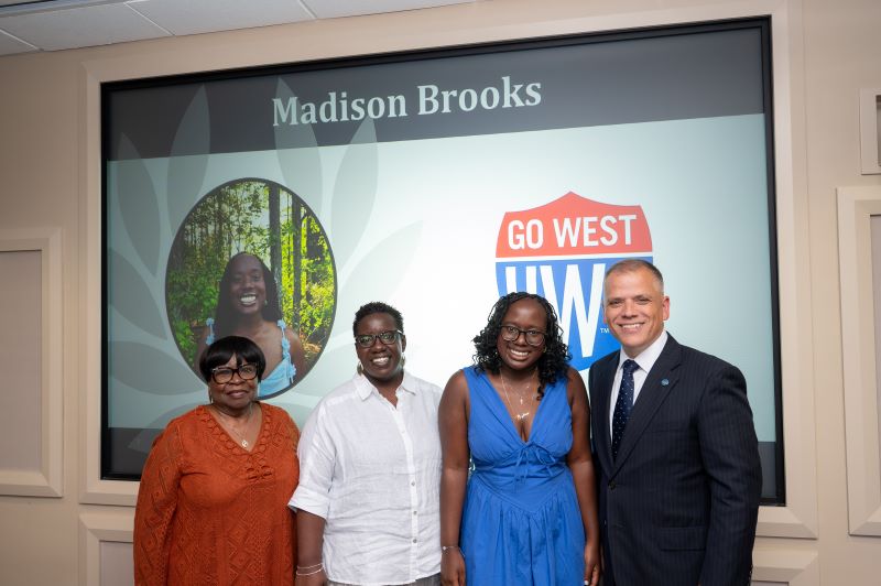 Madison Brooks, second from right, was joined by family members and Dr. Michael Johnson, UWG president, on Academic Recognition Day.