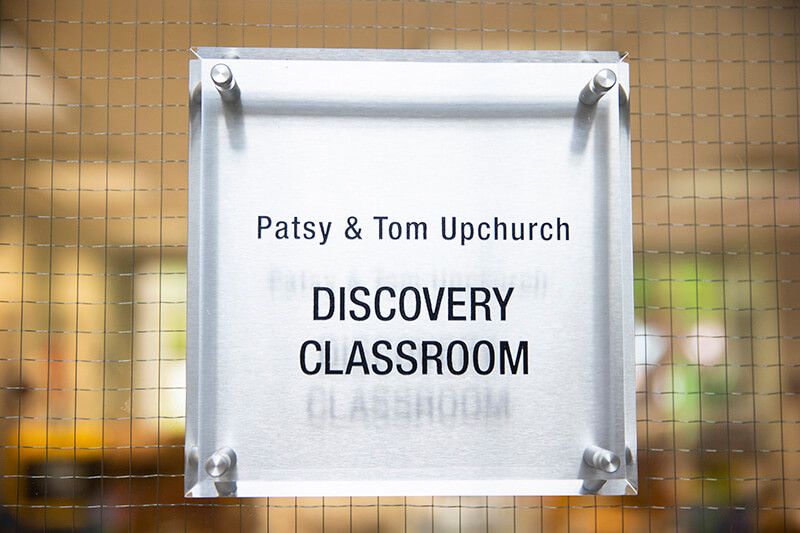 Sign that reads “Patsy & Tom Upchurch Discovery Classroom” at UWG