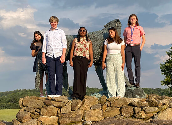 Georgia Scholars Institute participants at the wolf statue at Wolf Plaza on the University of West Georgia's campus