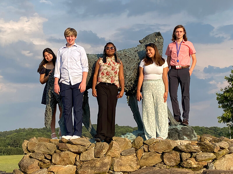 Georgia Scholars Institute participants in front of the wolf statue at Wolf Plaza at the University of West Georgia