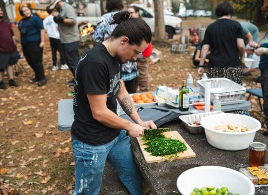 UWG student preparing food outdoors