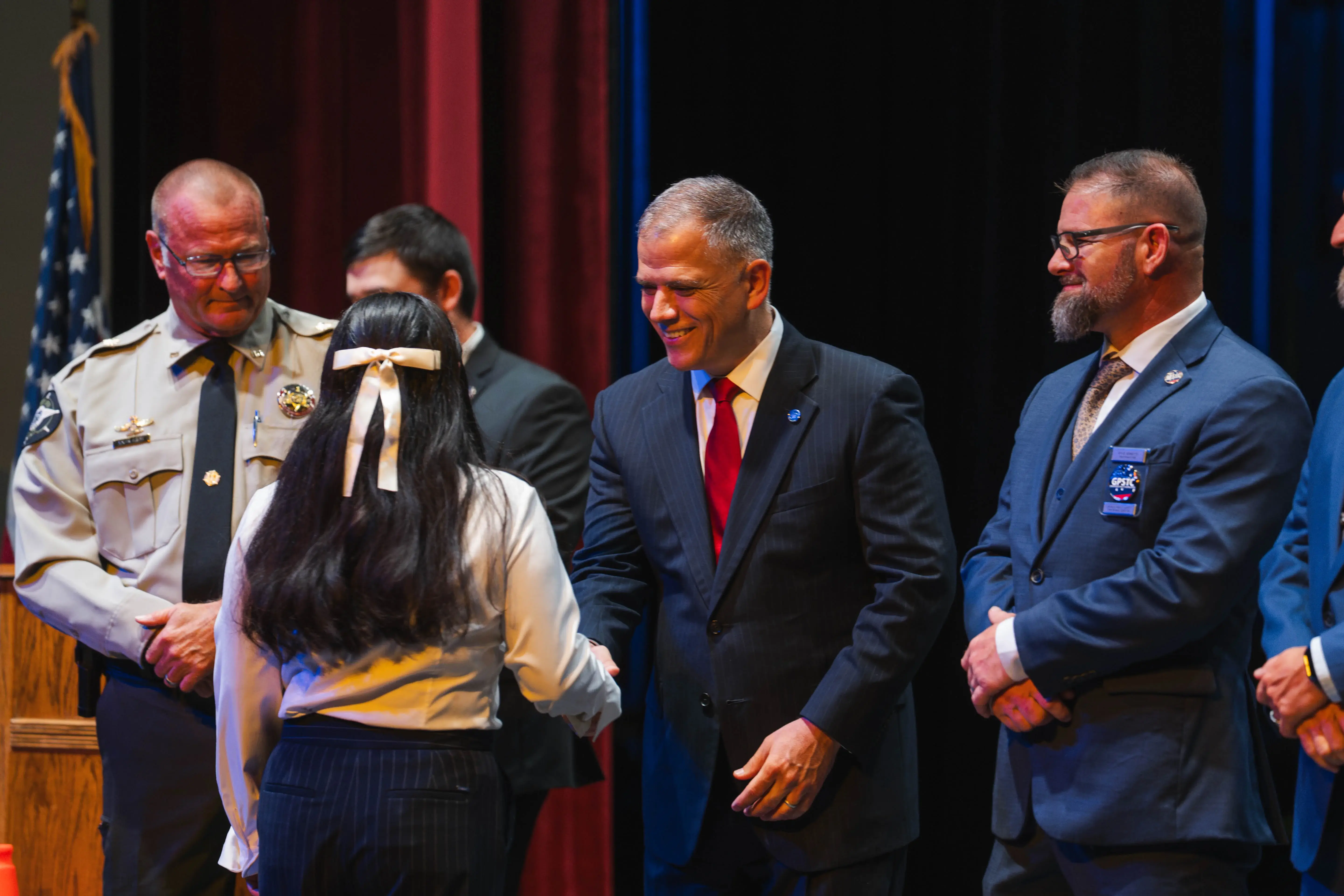 Dr. Michael Johnson, UWG president, congratulates an ALETE graduate